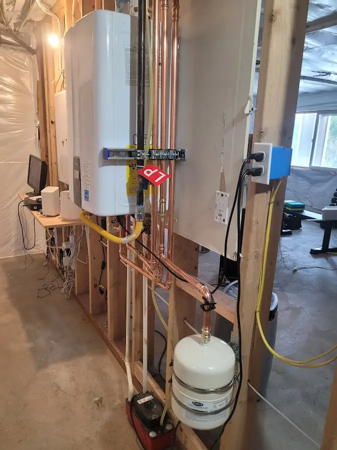 Licensed plumber repairing a kitchen sink in Hebron